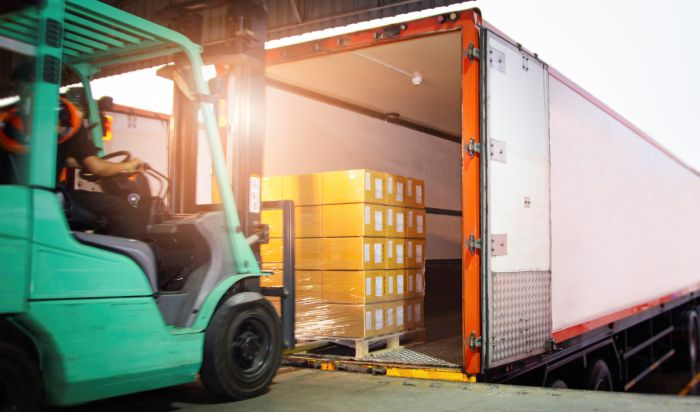 Pallets are being loaded in truck